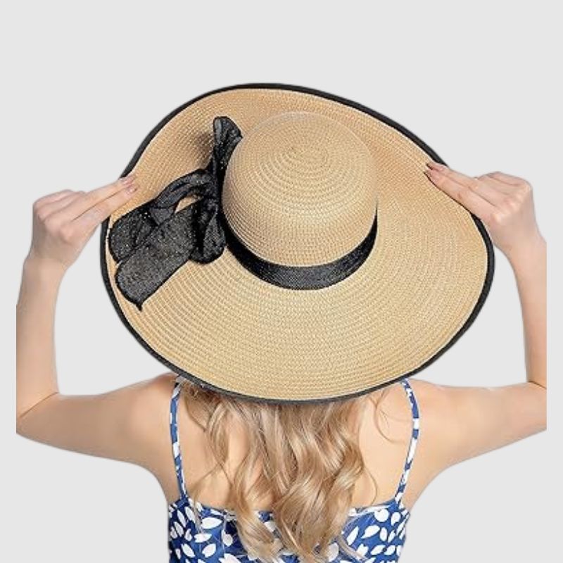 straw hat with black ribbon