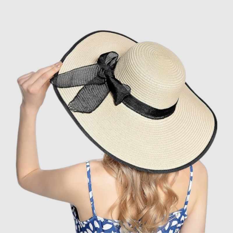 straw hat with black ribbon